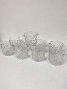 A set of nine moulded and slice cut glass double lipped wine glass rincers (11cm x d.11cm)