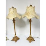 A pair of cream and gilt painted finish anodised metal fluted column table lamps with acanthus