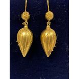 A pair of 19thc yellow metal teardrop shaped pendant earrings decorated with wirework and ball