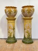 A pair of Victorian ceramic jardinieres on stands, the jardiniere with flared and scalloped rim over
