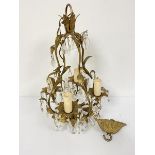 A gilt metal four branch pear shaped pendant glass faceted drop mounted light fitting complete
