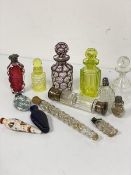 A collection of Victorian and later perfume bottles including an amethyst to clear to irradiated