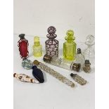 A collection of Victorian and later perfume bottles including an amethyst to clear to irradiated