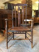 An early 20th century Glasgow school inlaid mahogany side chair, with rail back and open arms over