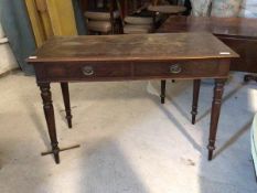 A Victorian mahogany side table, the rectangular moulded top over two drawers, raised on turned