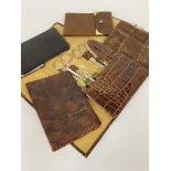 A vintage imprinted crocodile skin manicure set, four various leather wallets etc. (a lot)