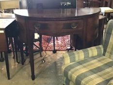 A Georgian style inlaid mahogany demi-lune sideboard, the cross banded top over a drawer and two