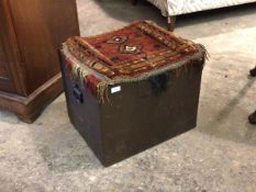 A painted wooden coal box, with Persian type carpet covered top over hinged lid and carry handle