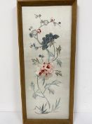 A 1920s Chinese silk embroidered panel with crysanthemums on grey silk ground, in oak glazed