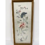 A 1920s Chinese silk embroidered panel with crysanthemums on grey silk ground, in oak glazed