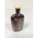 A 19thc rosewood snuff bottle with yellow metal niello style work chrysanthemum decoration, with