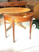 A George III inlaid mahogany demi-lune card table, the fold over top revealing baize lined playing