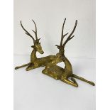 A pair of cast brass Thai style seated deer figures (33cm x 34cm)