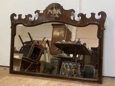 A walnut fretwork small overmantel mirror in 18th century style, the shaped rectangular plate within