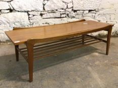 A Vintage mid century teak coffee table, the rectangular top raised on square splayed supports