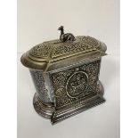 An Edwardian Epns biscuit barrel with greyhound surmount, with chased mask and scrolling design,