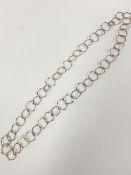 A modernist octagonal chain link sterling silver necklace, with two loop fastenings, stamped