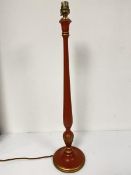A treen red and gilt lacquered candlestick baluster table lamp on footed circular moulded base (