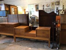 A mid 20th century teak veneered dressing table, the swing mirror over four drawers and a hinged