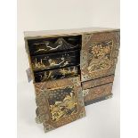 A Japanese Meiji period lacquered cabinet, the top with stylised floral design, the pair of panel