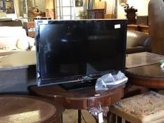 A Panasonic 31" flat screen tv, with power lead and two remotes