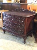 A continental style mahogany chest, the scrolled acanthus carved raised back over three drawers,