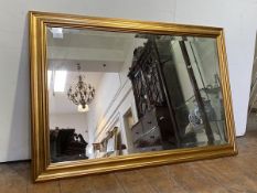 A traditional gilt framed wall hanging mirror of rectangular form, with bevelled plate H68cm x 98cm