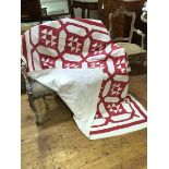 A 1920s comfy quilt with red octagonal panel design - signs of gentle use, 170cm x 170cm