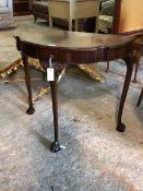 A reproduction Georgian style cross banded mahogany demi-lune console table, with single drawer,