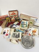 A collection of humerous and pictorial postcards, Monopoly game, various card packs, cigarette