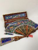A 19thc Chinese black and gilt lacquered fan case containing a 19thc hand painted red lacquered