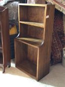 A 20th century walnut waterfall bookcase with three tiers, H102cm, W51cm, D28cm