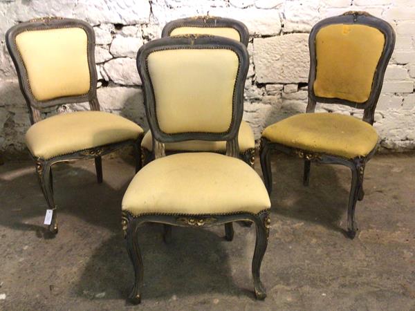 A set of four French Louis XV style side chairs, having floral carved painted frames, upholstered