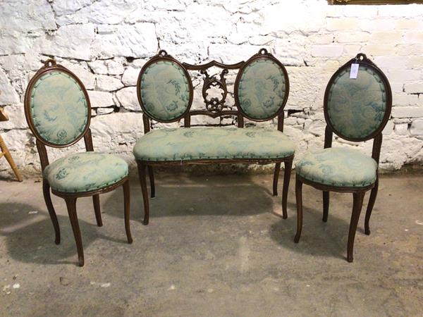 A Late 19th century French three piece drawing room suite, comprising a two seat settee, upholstered