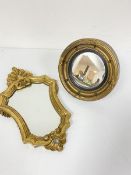 A rococo style giltwood miniature wall mirror (33cm) and a miniature convex ball pattern gilt
