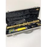 A Symphony brass saxophone complete with mouthpiece, two attachments, hard carrying case etc.