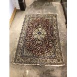 Persian design ground rug, centred by floral medallion on field with interlaced trailing foliate,