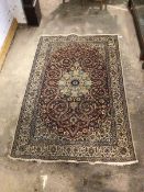 Persian design ground rug, centred by floral medallion on field with interlaced trailing foliate,