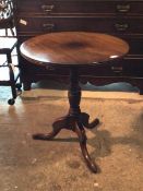 George III mahogany tripod table, the single plank circular top with reeded edge over ring turned