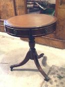 A Regency design mahogany drum table, the circular top with inset tooled leather surface, over