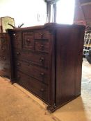 A 19thc mahogany chest of drawers, the inverted top above a central square drawer, flanked by a