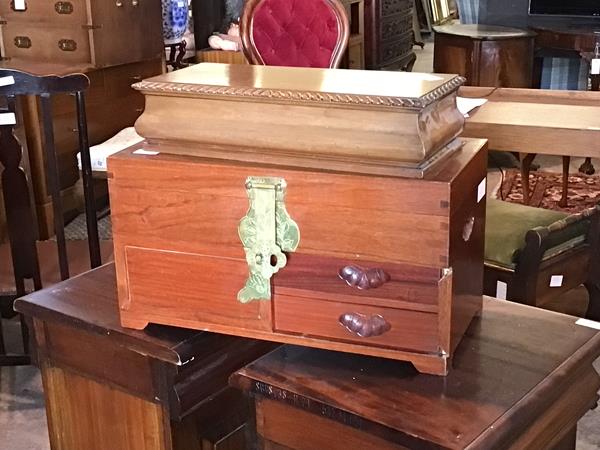 A 20th century Chinese hardwood jewellery box, the hinged lid revealing blue fabric lined