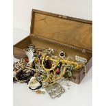A Ricordo walnut swallow rectangular box containing a collection of paste brooches, bead