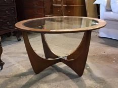 G-Plan - A Vintage mid century teak 'Astro' circular coffee table, with inset glass top, raised on