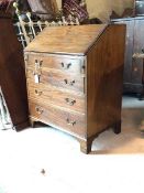 An Edwardian mahogany bureau, in the George III taste, the fall front revealing a baize lined