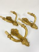 A set of three Italian style giltwood twin branch electrified wall sconces (needing re-wiring) (32cm