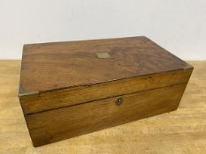 A 19thc writing slope with brass shield plaque to top and caps to corners, interior a/f (15cm x 40cm