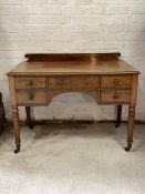 A Victorian mahogany wash stand, the raised back over one long and four short drawers, raised on