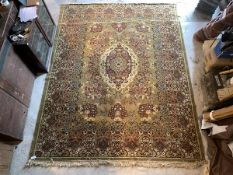 A Perisan design ground carpet, the yellow field with floral decoration centred by medallion,