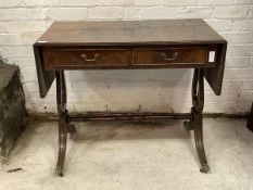 A reproduction Regency style mahogany sofa table, the top with two drop leaves over two drawers,